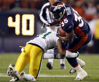 Selvin Young tries to break a Packer tackle