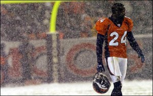 Champ Bailey leaves the snowy field in a 2004 game vs. the Oakland Raiders. Sporting the alternate orange jersey.