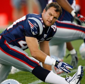 John Lynch stretches before the preseason New England Patriots vs. Philadelphia Eagles game.