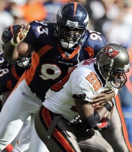 Nic Clemons tackles Warrick Dunn (Reuters)