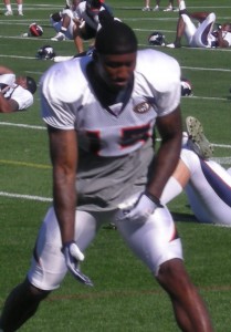 Denver Broncos wide receiver Brandon Marshall tosses his helmet during the team's 2009 training camp.  (BroncoTalk/Kyle Montgomery)