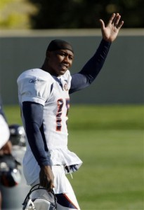 Denver Broncos wide receiver Brandon Marshall waves as he heads to the practice field to take part in drills at the team's NFL football training camp Wednesday, Aug. 19, 2009, in Englewood, Colo. (AP Photo/David Zalubowski)