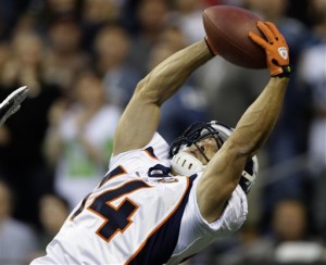 Broncos' Brandon Stokley catches a 3-yard pass for a touchdown in the first quarter against the Seahawks' Saturday, Aug. 22, 2009, in an NFL preseason football game. (AP Photo/Elaine Thompson)