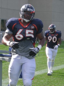 Rulon Davis (65) and Kenny Peterson (90) participate in defensive line drills during Denver Broncos training camp on August 3, 2009.  (BroncoTalk/Kyle Montgomery)