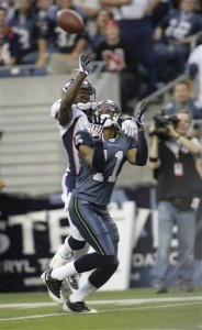 Seattle Seahawks' Deon Butler catches a 34-yard touchdown pass while Denver Broncos' Andre' Goodman defends in the first quarter of a NFL preseason football game, Saturday, Aug. 22, 2009, in Seattle. (AP Photo/Ted S. Warren)