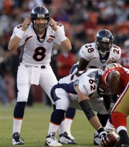 Denver Broncos quarterback Kyle Orton (8) calls the play at the line of scrimmage against the San Francisco 49ers in the second quarter during their NFL preseason football game in San Francisco, Calif., Friday, Aug. 14, 2009. (AP Photo/Jeff Chiu)