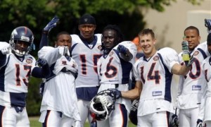 Denver Broncos wide receivers, from left, Travis Shelton, Eddie Royal, Brandon Marshall, Chad Jackson, Brandon Stokley and Jabar Baffney joke with photographers during a break in drills at  NFL football training camp at team's headquarters on Tuesday, Aug. 18, 2009, in Englewood, Colo. (AP Photo/David Zalubowski)