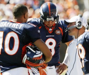Denver Broncos WR Jabar Gaffney, QB Kyle Orton and Coach Josh McDainels converse on the sideline in 2009 Week 1 NFL action. (REUTERS/John Sommers)
