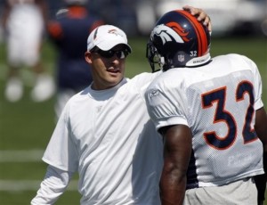 Denver Broncos coach Josh McDaniels, left, jokes with running back LaMont Jordan during practice at the NFL football team's headquarters in Englewood, Colo., on Wednesday, Sept. 9, 2009. (AP Photo/David Zalubowski)