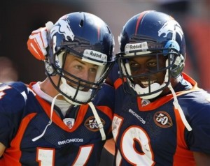 Denver Broncos receivers Brandon Stokley (14) and Eddie Royal (19) celebrate after Stokley scored on an 87-yard pass reception in the fourth quarter of an NFL football game against the Cincinnati Bengals, Sunday, Sept. 13, 2009, in Cincinnati. Denver won the game 12-7. (AP Photo/Ed Reinke)