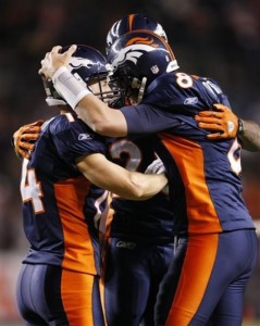 Denver Broncos wide receiver Brandon Stokley, left, is congratulated by quarterback Kyle Orton, right, after catching a 17-yard touchdown pass from Orton during the fourth quarter of an NFL football game in Denver, Thursday, Nov. 26, 2009. (AP Photo/Jack Dempsey)