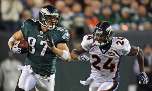 Tight end Brent Celek #87 of the Philadelphia Eagles runs with the ball while being pursued by cornerback Champ Bailey #24 of the Denver Broncos on December 27, 2009 at Lincoln Financial Field in Philadelphia, Pennsylvania. The Eagles won 30-27.  (Drew Hallowell/Getty Images)