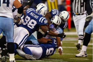 Quarterback Vince Young #10 of the Tennessee Titans is sacked by Robert Mathis #98 and several other defenders in the first half against the Indianapolis Colts at Lucas Oil Field on December 6, 2009 in Indianapolis, Indiana. (Scott Boehm/Getty Images)