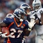 Denver Broncos rookie running back Knowshon Moreno (27) runs with the ball around the corner as Oakland Raiders defensive tackle Tommy Kelly (93) defends in the third quarter of an NFL football game in Denver on Sunday, Dec. 20, 2009. (AP Photo/David Zalubowski)