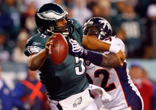 Donovan McNabb #5 of the Philadelphia Eagles is pressured by Elvis Dumervil #92 of the Denver Broncos on December 27, 2009 at Lincoln Financial Field in Philadelphia, Pennsylvania. The Eagles defeated the Broncos 30-27.  (Jim McIsaac/Getty Images)