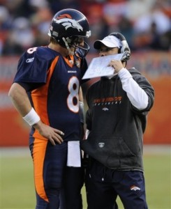 Denver Broncos head coach Josh McDaniels, right, talks to quarterback Kyle Orton during a break in the action during the third quarter of of an NFL  football game against the Oakland Raiders in Denver on Sunday, Dec. 20, 2009. (AP Photo/Chris Schneider)
