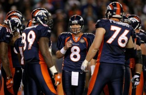 Quarterback Kyle Orton #8 of the Denver Broncos runs the offensive huddle against the New York Giants during NFL action at Invesco Field at Mile High on November 26, 2009 in Denver, Colorado.  (Doug Pensinger/Getty Images)