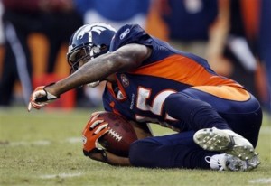 Denver Broncos wide receiver Brandon Marshall reacts after catching a pass for a touchdown against the Oakland Raiders in the third quarter of an NFL football game in Denver on Sunday, Dec. 20, 2009. (AP Photo/David Zalubowski)