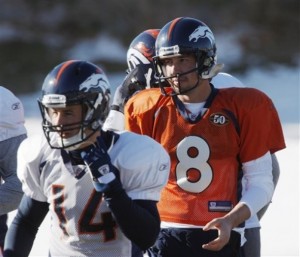 Denver Broncos quarterback Kyle Orton (8) directs wide receiver Brandon Stokley as they take part in an NFL football practice at the team's headquarters in Englewood, Colo., on Thursday, Dec. 31, 2009. (AP Photo/David Zalubowski)
