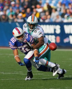 Nathan Jones, seen here as a member of the Miami Dolphins (#33), defends on a pass intended for Josh Reed #82 of the Buffalo Bills in 2009.  (Rick Stewart/Getty Images)