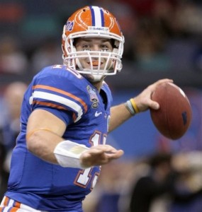 Florida quarterback Tim Tebow looks to pass during the 2010 Sugar Bowl.  Tebow was drafted in the first round of the 2010 NFL Draft by the Denver Broncos.  (AP Photo/Dave Martin)