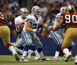 Cory Procter protects Dallas Cowboys quarterback Tony Romo in a 2009 preseason game against the San Francisco 49ers