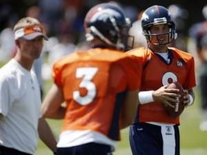 Tom Brandstater throws a pass as Kyle Orton and Mike McCoy look on during 2009's training camp. (AP Photo/David Zalubowski)