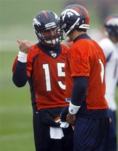 A sign of things to come? Tim Tebow confers with Brady Quinn during Broncos minicamp at Dove Valley. (AP Photo/David Zalubowski) 