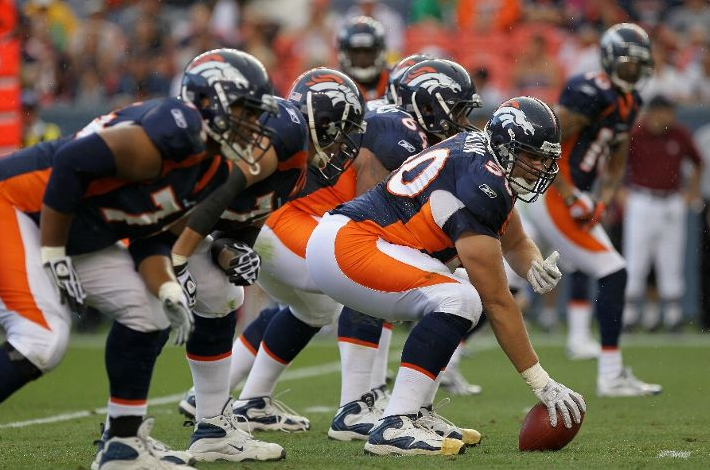 enter J.D. Walton #50 of the Denver Broncos leads the offensive line as he prepares snap the ball against the Pittsburgh Steelers during preseason NFL action at INVESCO Field at Mile High on August 29, 2010 in Denver, Colorado. The Broncos defeated the Steelers 34-17. (Photo by Doug Pensinger/Getty Images)