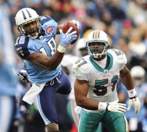 Tennessee Titans wide receiver Kenny Britt (18) catches a pass in front of Miami Dolphins linebacker Akin Ayodele (51) in 2009. The Broncos signed the free agent Ayodele Saturday. (AP Photo/John Russell)