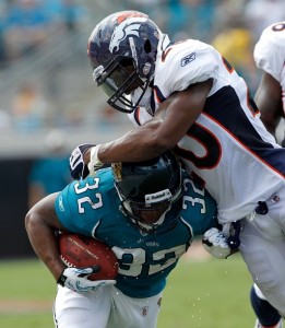 Safety Brian Dawkins #20 of the Denver Broncos attempts to tackle Maurice Jones-Drew #32 of the Jacksonville Jaguars during the NFL season opener game at EverBank Field on September 12, 2010 in Jacksonville, Florida.  (Sam Greenwood/Getty Images)