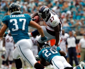 Anthony Smith #20 of the Jacksonville Jaguars attempts to tackle Knowshon Moreno #27 of the Denver Broncos during the NFL season opener game at EverBank Field on September 12, 2010 in Jacksonville, Florida.  (Sam Greenwood/Getty Images)