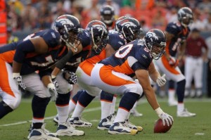 Center J.D. Walton #50 of the Denver Broncos leads the offensive line as he prepares to snap the ball against the Pittsburgh Steelers during preseason NFL action at INVESCO Field at Mile High on August 29, 2010 in Denver, Colorado. (Doug Pensinger/Getty Images)