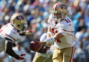 Alex Smith hands off to Frank Gore of the San Francisco 49ers on October 24, 2010 in Charlotte, North Carolina.  (Streeter Lecka/Getty Images)