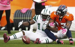 Denver Broncos safety Renaldo Hill (R) collides with New York Jets wide receiver Santonio Holmes on the one-yard-line in the fourth quarter of their NFL football game in Denver October 17, 2010. Hill was called for pass interference on the play. (REUTERS/Rick Wilking)