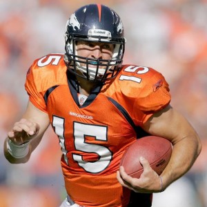 Quarterback Tim Tebow #15 of the Denver Broncos runs for a touchdown against the New York Jets at INVESCO Field at Mile High on October 17, 2010 in Denver, Colorado.  (Justin Edmonds/Getty Images)