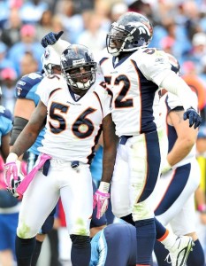 Robert Ayers #56 and Jason Hunter #52 of the Denver Broncos celebrate after a defensive stop against the Tennessee Titans  at LP Field on October 3, 2010 in Nashville, Tennessee. Denver won 26-20.  (Grant Halverson/Getty Images)