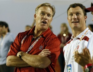 John Elway & John Lynch look on during the Stanford and Virginia Tech 2011 Discover Orange Bowl game. (REUTERS/Hans Deryk)