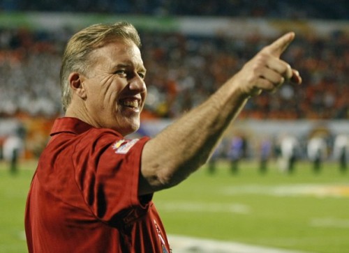 Former Stanford and NFL player John Elway stands on the sideline as Stanford and Virginia Tech met in the 2011 Discover Orange Bowl NCAA football game in Miami, January 3, 2011. (REUTERS/Hans Deryk)