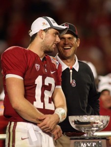 Quarterback Andrew Luck and head coach Jim Harbaugh of the Stanford Cardinal celebrate with the trophy on stage after Stanford won 40-12 against the Virginai Tech Hokies during the 2011 Discover Orange Bowl at Sun Life Stadium on January 3, 2011 in Miami, Florida.  (Marc Serota/Getty Images)