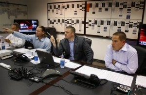 Matt Russell, Brian Xanders and Josh McDaniels just prior to the draft day trade for Tim Tebow. (AP Photo/Denver Broncos, Eric Lars Bakke)