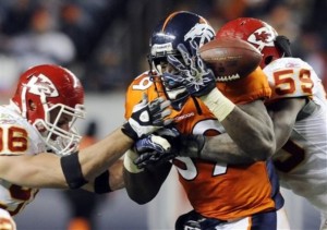 Daniel Graham has a pass intended for him disrupted in a game against the Kansas City Chiefs in 2010. (AP Photo/Jack Dempsey)