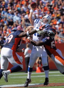 Kevin Vickerson and Robert Ayers narrowly miss Peyton Manning. (Photo by Doug Pensinger/Getty Images)
