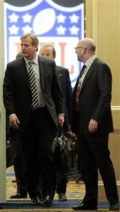 NFL commissioner Roger Goodell, left, leaves CBA negotiations on Wednesday, March 2, 2011. (AP Photo/Luis M. Alvarez)
