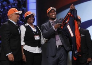 Texas A&M linebacker Von Miller, right, gestures alongside family after he was selected as the second overall pick by the Denver Broncos in the first round of the NFL football draft at Radio City Music Hall Thursday, April 28, 2011, in New York. (AP Photo/Jason DeCrow)