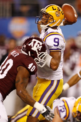 Jordan Jefferson of the LSU Tigers throws under pressure from Von Miller of the Texas A&M Aggies during the AT&T Cotton Bowl.  (Photo by Chris Graythen/Getty Images)