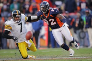 Ben Roethlisberger #7 of the Pittsburgh Steelers looses the ball against Elvis Dumervil #92 of the Denver Broncos during the AFC Wild Card Playoff game at Sports Authority Field at Mile High on January 8, 2012 in Denver, Colorado.  (Doug Pensinger/Getty Images)