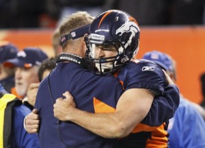 Denver Broncos' offensive coordinator Mike McCoy congratulates quarterback Tim Tebow  after Tebow scored the game-winning touchdown against the New York Giants in their NFL football game in Denver November 17, 2011. (REUTERS photo/Rick Wilking)