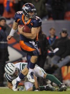 Quarterback Tim Tebow #15 of the Denver Broncos eludes Eric Smith #33 of the New York Jets and rushes 20 yards for the game winning touchdown in the fourth quarter at Sports Authority Field at Mile High on November 17, 2011 in Denver, Colorado. The Broncos defeated the Jets 17-13.  (Photo by Doug Pensinger/Getty Images)