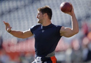 Tim Tebow #15 of the Denver Broncos warms up prior to the game against the Chicago Bears at Invesco Field at Mile High on December 11, 2011 in Denver, Colorado.  (Photo by Doug Pensinger/Getty Images)